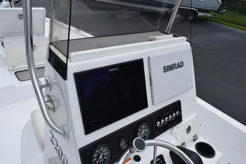 Slide: The Image of 2017 Blazer Bay 2200 boat dashboard with Simrad navigation system. - 20