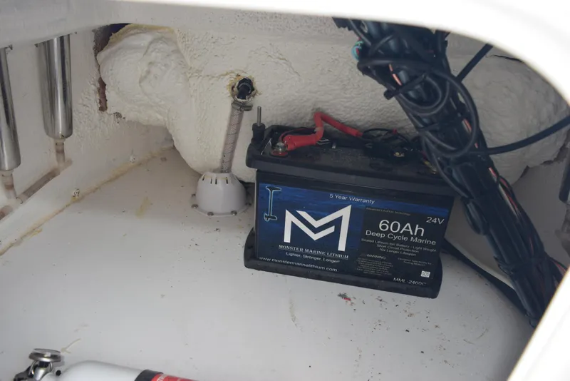 Slide: The Image of Battery compartment of 2017 Blazer Bay 2200 with 60Ah deep cycle marine battery. - 22