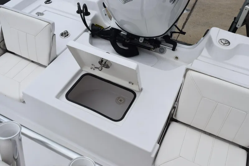 Slide: The Image of 2017 Blazer Bay 2200 boat interior with open storage compartment and seating. - 24