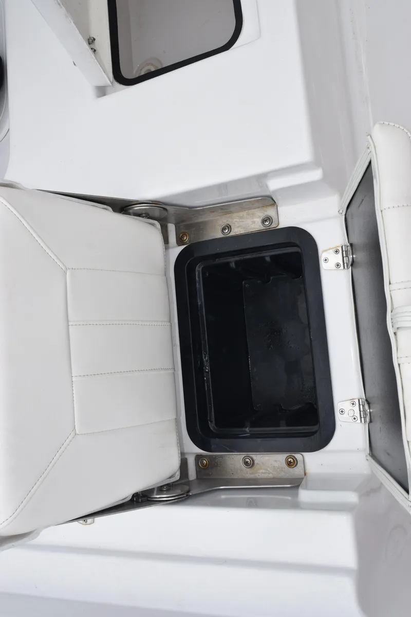 Slide: The Image of 2017 Blazer Bay 2200 boat seat with storage compartment, open view. - 26