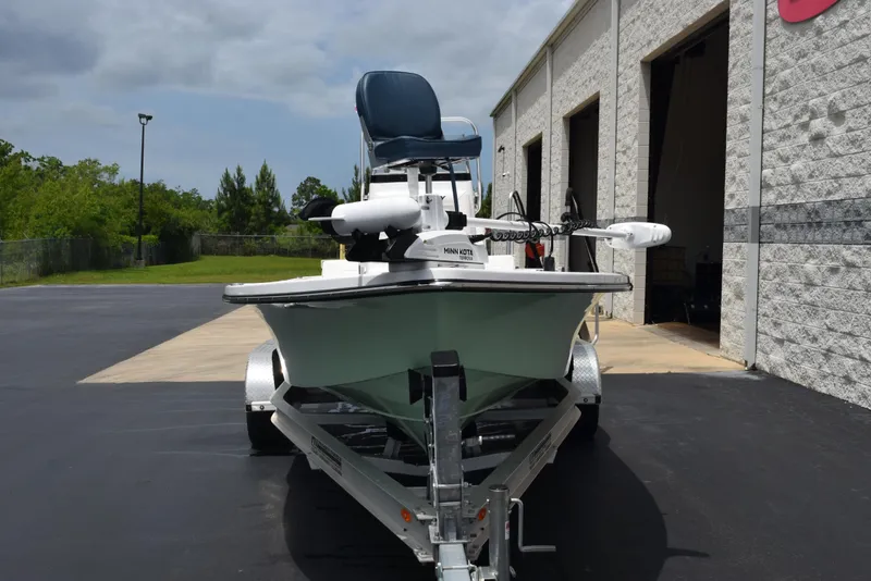 Slide: The Image of 2017 Blazer Bay 2200 boat on trailer outside a building. - 3