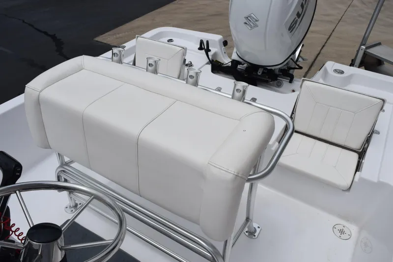 Slide: The Image of 2017 Blazer Bay 2200 boat interior with white seating and steering wheel. - 9