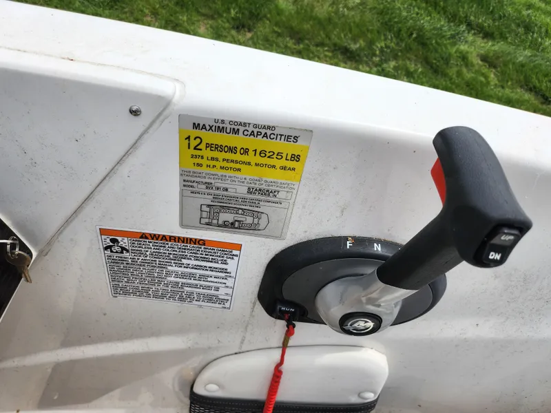 Slide: The Image of Boat control panel with capacity label, Starcraft SVX 191 OB, 2021 model, 12-person limit. - 13