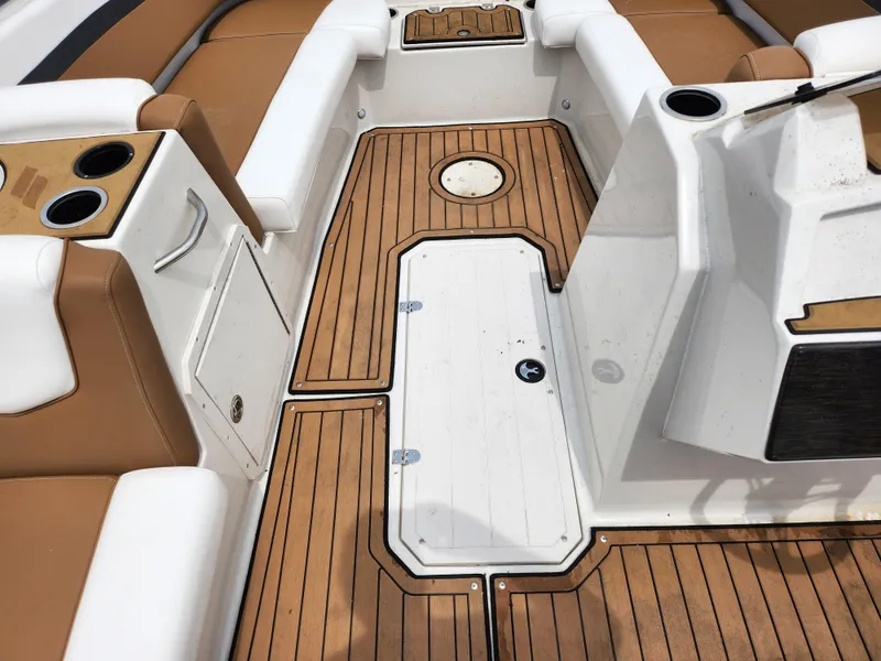 Slide: The Image of 2021 Starcraft SVX 191 OB boat interior with teak flooring and tan seating. - 15