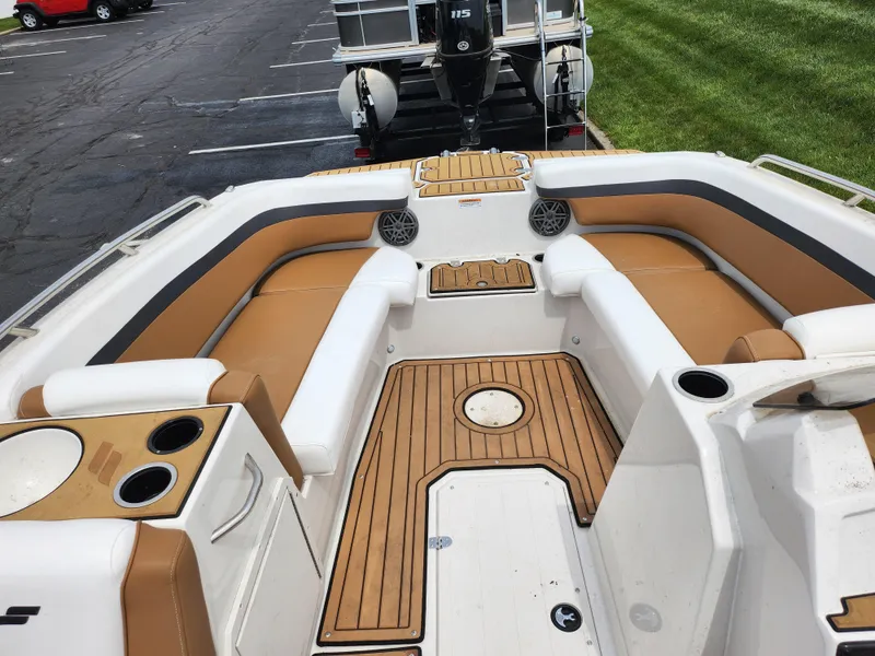 Slide: The Image of 2021 Starcraft SVX 191 OB boat interior with tan seating and wood accents. - 16