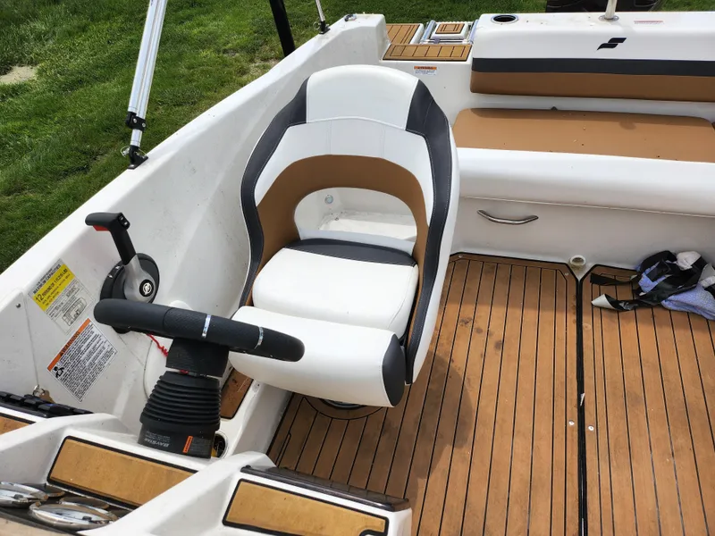 Slide: The Image of 2021 Starcraft SVX 191 OB boat interior with cushioned seating and wood-style flooring. - 20