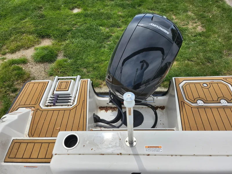 Slide: The Image of 2021 Starcraft SVX 191 OB boat with outboard motor and wooden deck, viewed from above. - 23
