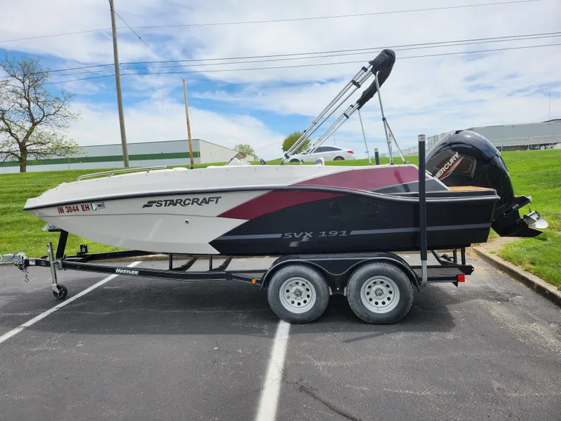 Slide: The Image of 2021 Starcraft SVX 191 OB boat on trailer in parking lot. - 5