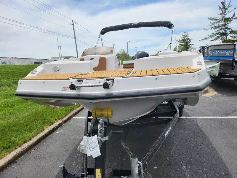 Slide: The Image of 2021 Starcraft SVX 191 OB boat on trailer, parked outdoors. - 7