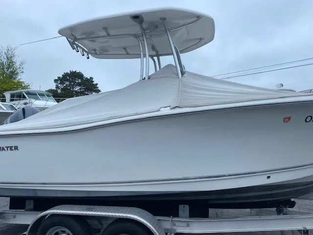 Slide: The Image of 2014 Tidewater 216 CC Adventure boat on trailer, covered and ready for transport. - 1