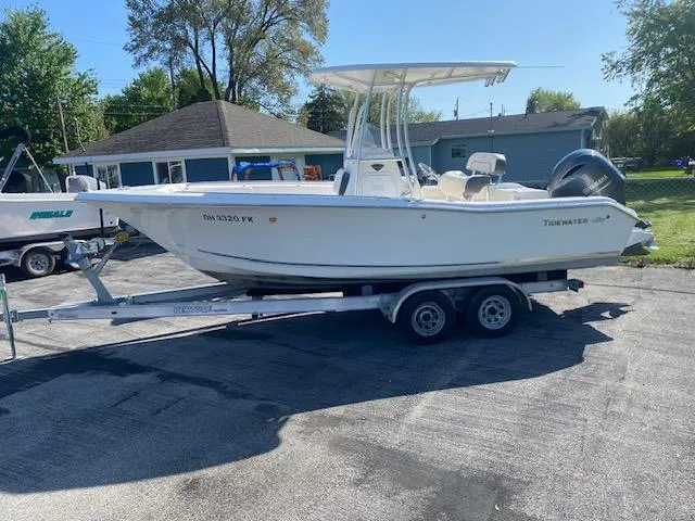 Slide: The Image of 2014 Tidewater 216 CC Adventure boat on trailer in residential driveway. - 3