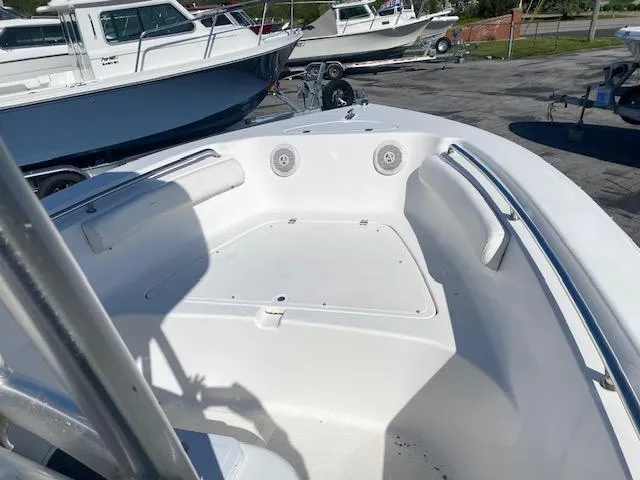 Slide: The Image of 2014 Tidewater 216 CC Adventure boat interior with seating and storage. - 4