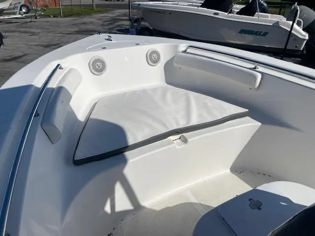 Slide: The Image of 2014 Tidewater 216 CC Adventure boat interior with cushioned seating and speakers. - 5