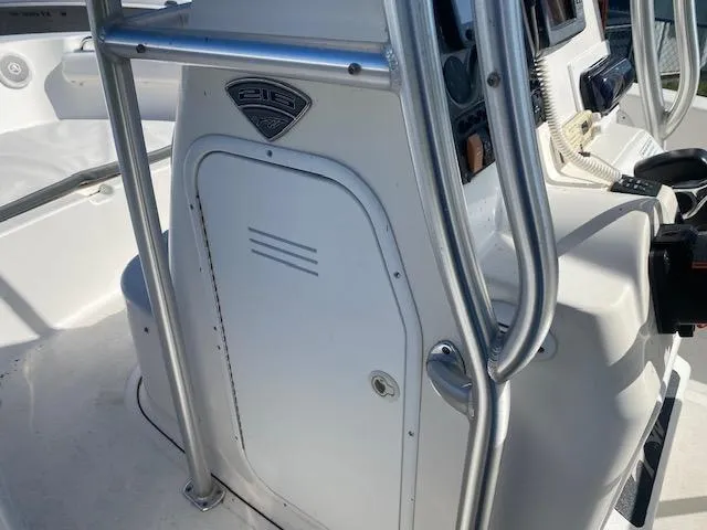Slide: The Image of 2014 Tidewater 216 CC Adventure boat console with stainless steel railings. - 7