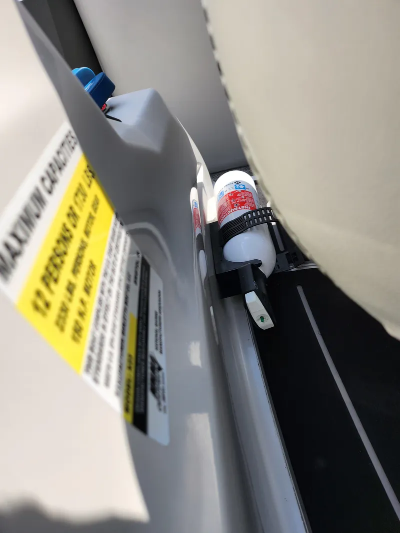 Slide: The Image of 2021 Barletta CORSA 23QC interior with safety label and fire extinguisher. - 15