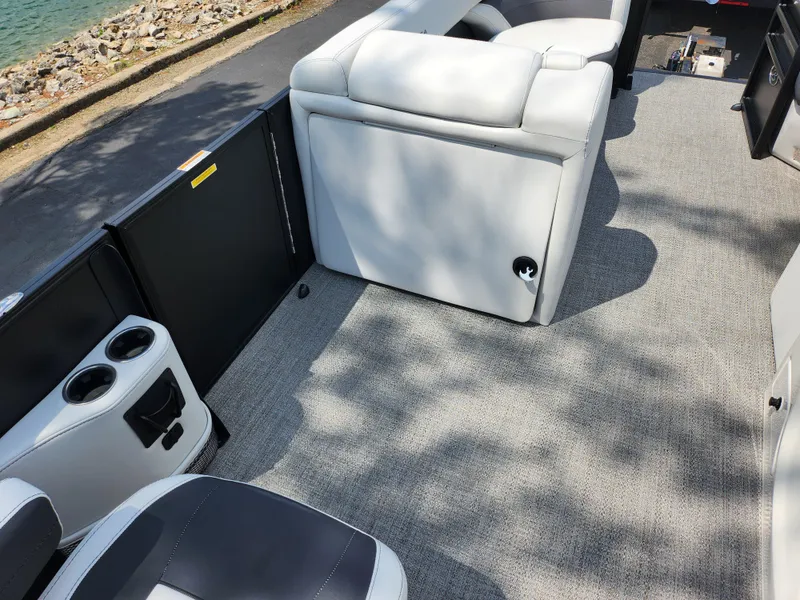 Slide: The Image of 2021 Barletta CORSA 23QC boat interior with plush seating and carpeted flooring. - 20