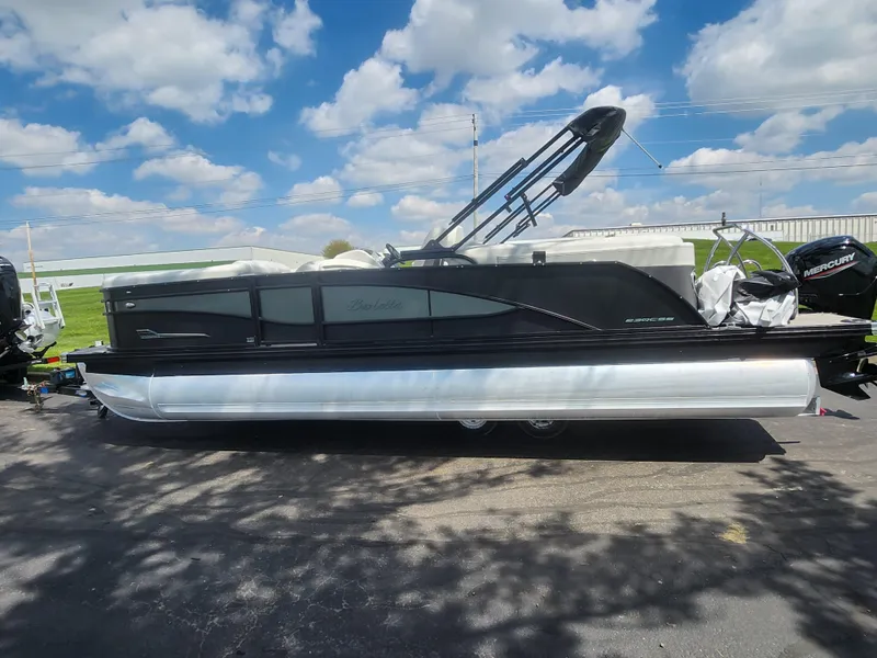 Slide: The Image of 2021 Barletta CORSA 23QC pontoon boat under a blue sky with clouds. - 4