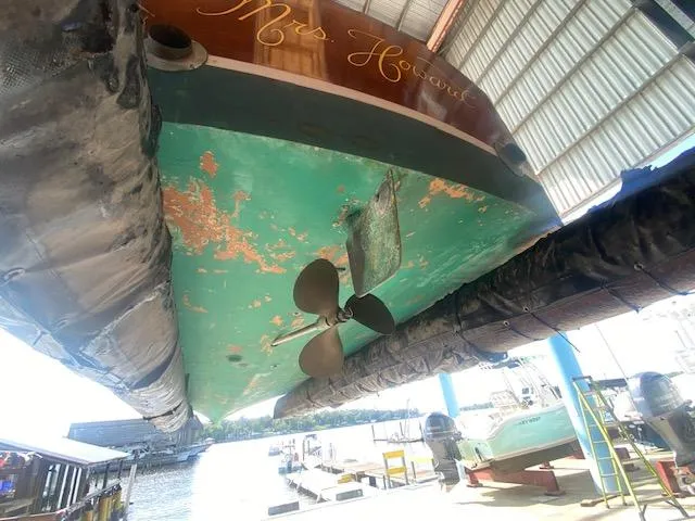 Slide: The Image of Grand Craft Classic Runabout 2000 under maintenance in a boatyard. - 16
