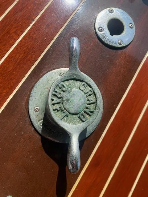 Slide: The Image of Grand Craft Classic Runabout 2000 boat detail with wooden deck and metal fitting. - 19