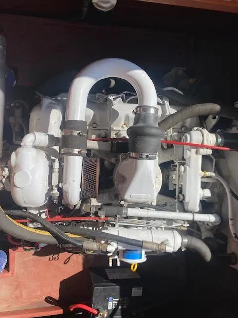 Slide: The Image of Engine of a 2000 Grand Craft Classic Runabout boat, showcasing intricate mechanical components. - 22