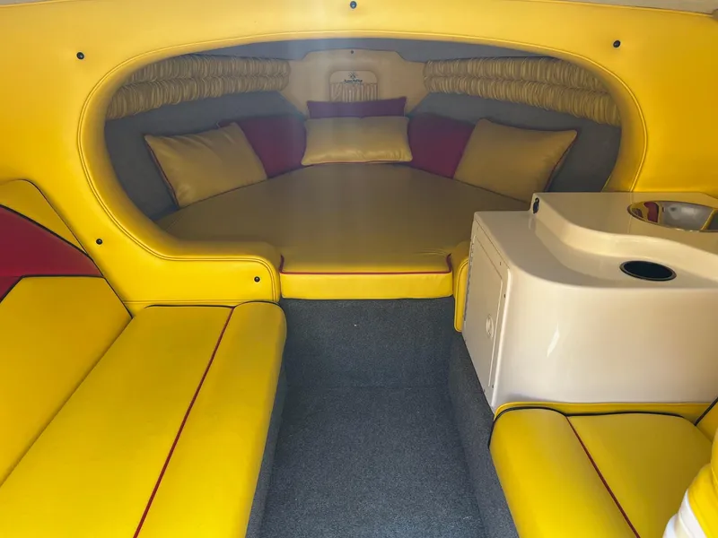 Slide: The Image of Yellow and gray interior of 2006 Kachina Drone 26 boat with seating and cushions. - 10
