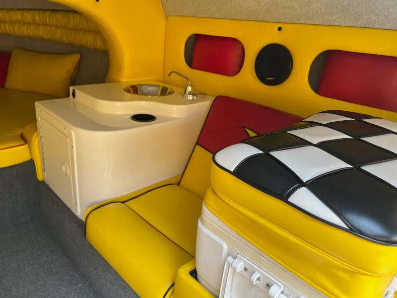Slide: The Image of Interior of 2006 Kachina Drone 26 with yellow seating and compact sink. - 11