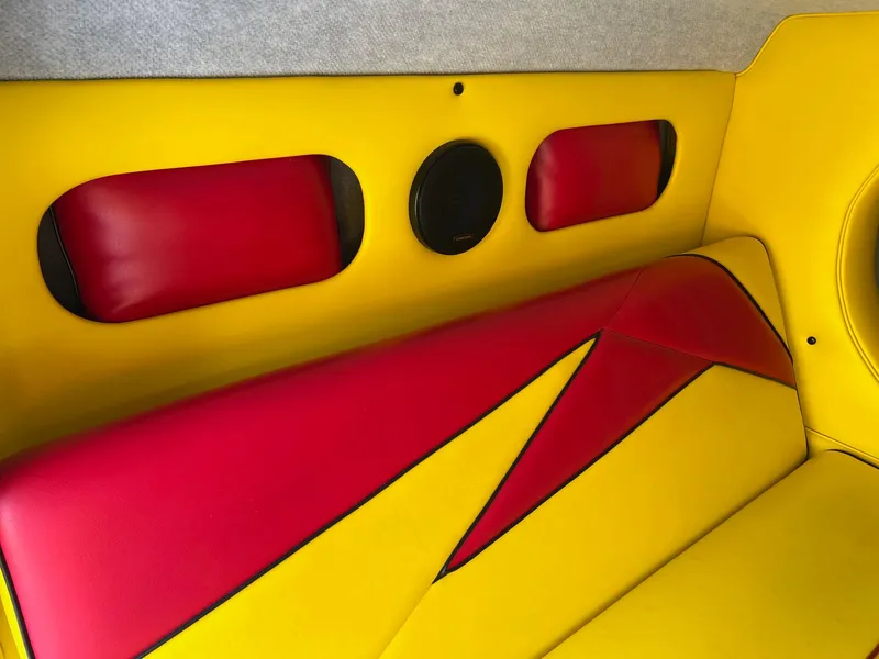 Slide: The Image of Yellow and red interior of 2006 Kachina Drone 26, featuring bold geometric design. - 14