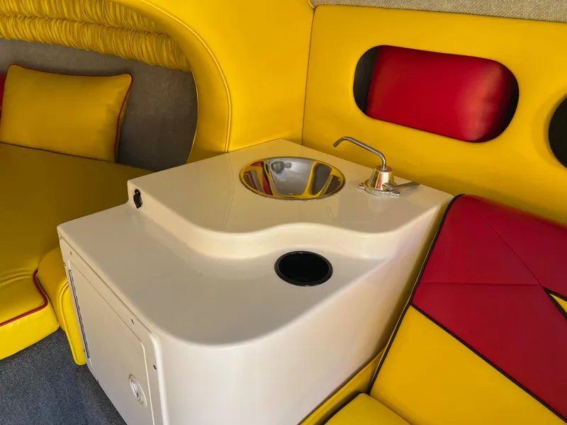 Slide: The Image of Yellow and red interior of 2006 Kachina Drone 26 with sink and seating. - 15