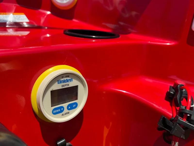 Slide: The Image of Red Kachina Drone 26 boat dashboard with Uniden depth gauge, 2006 model. - 21