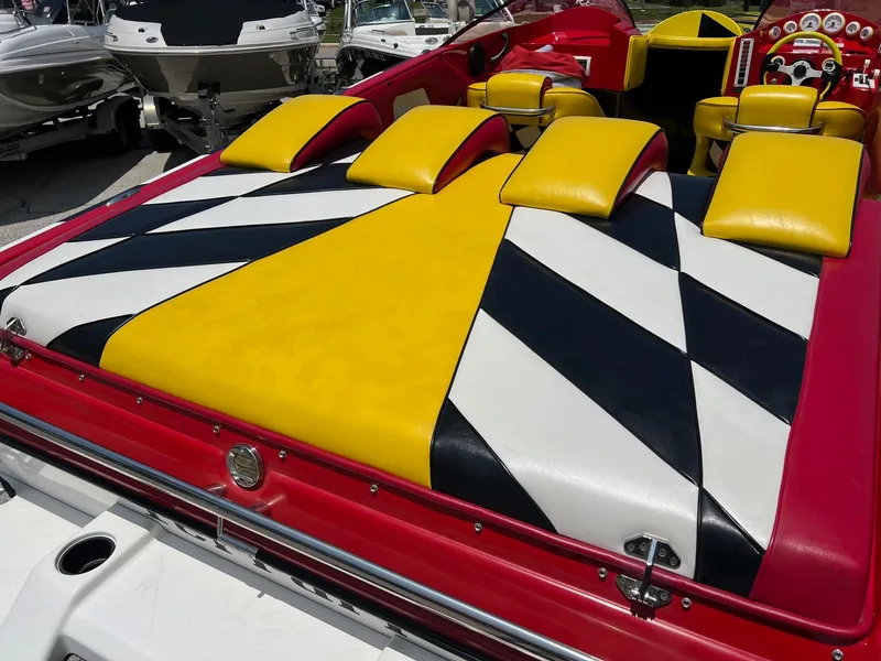 Slide: The Image of Vibrant Kachina Drone 26 boat interior with geometric yellow, black, and white upholstery, 2006 model. - 22
