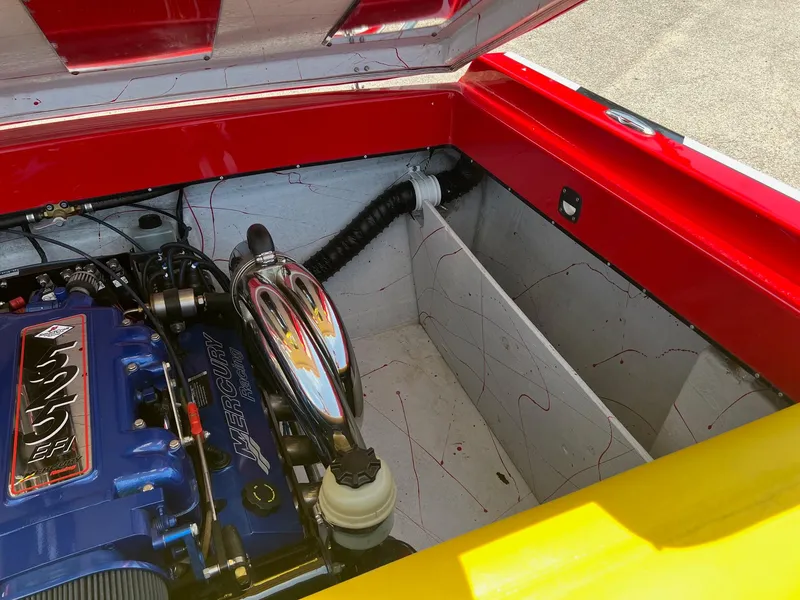 Slide: The Image of Engine compartment of a 2006 Kachina Drone 26 boat, featuring a vibrant color scheme. - 24