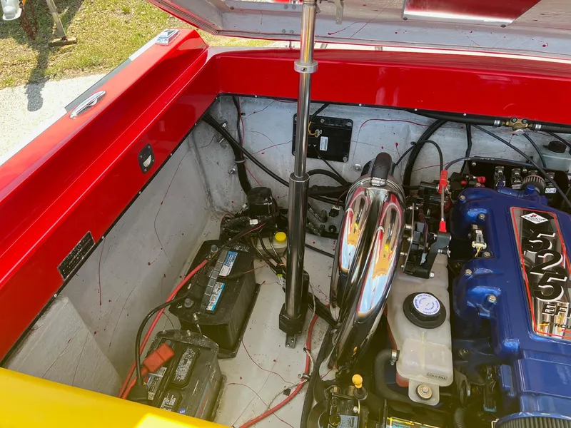 Slide: The Image of Engine compartment of a 2006 Kachina Drone 26 with visible components and wiring. - 25