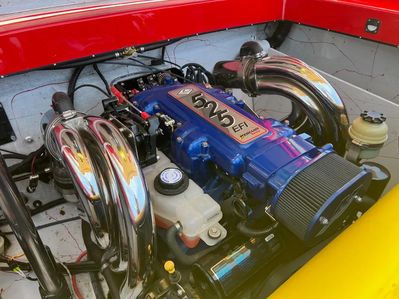 Slide: The Image of Engine of 2006 Kachina Drone 26 with blue EFI 525 horsepower motor. - 26