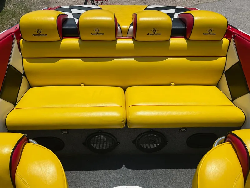 Slide: The Image of Yellow and red seating in a 2006 Kachina Drone 26 boat interior. - 3