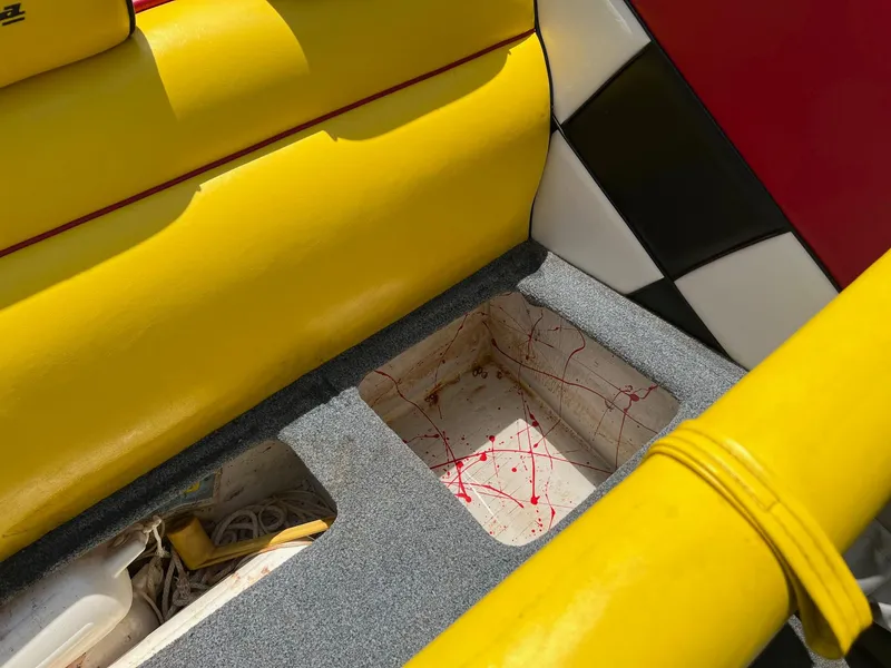 Slide: The Image of Yellow and gray interior of 2006 Kachina Drone 26 boat with storage compartments. - 5