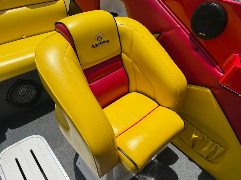 Slide: The Image of Yellow and red boat seat in a 2006 Kachina Drone 26. - 8