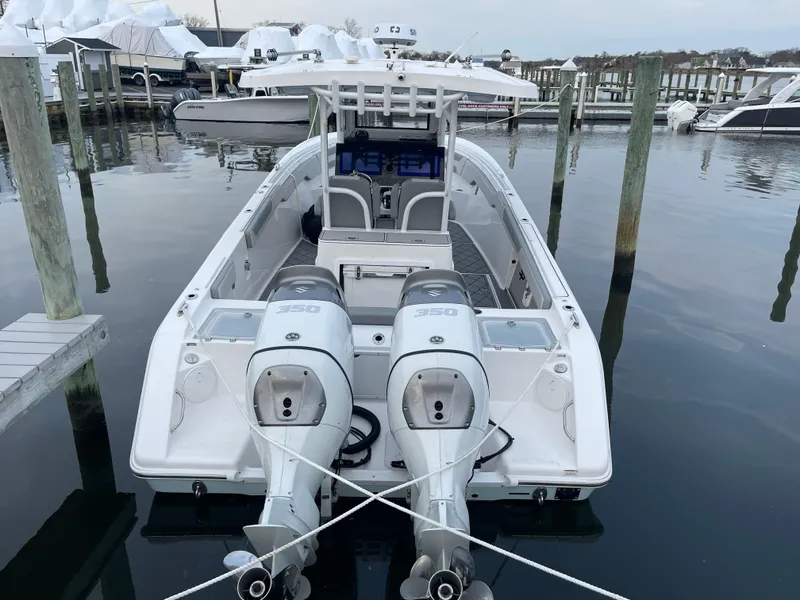 Slide: The Image of 2023 Sea Pro 320 DLX Offshore boat docked with twin engines. - 3