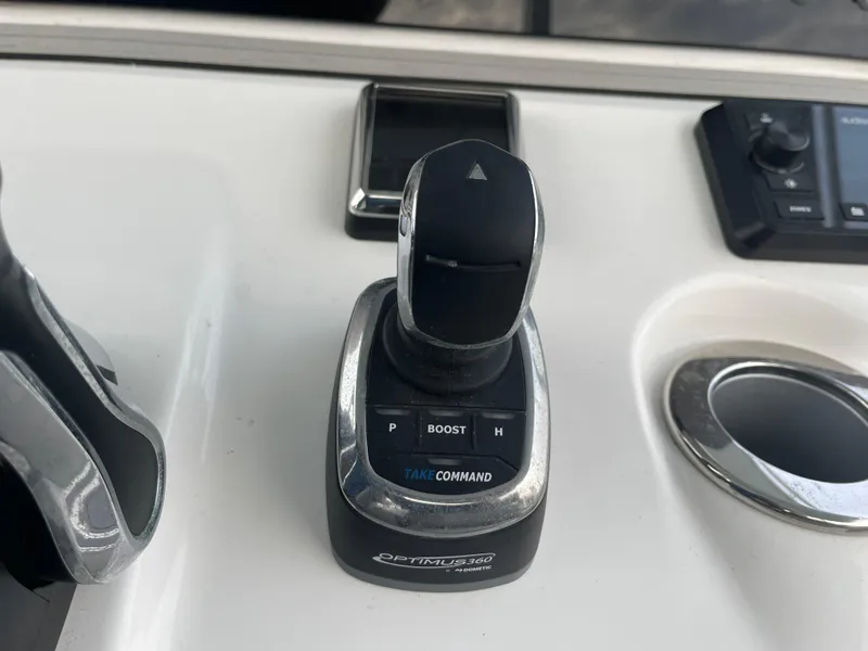 Slide: The Image of Joystick control on 2023 Sea Pro 320 DLX Offshore boat dashboard. - 8