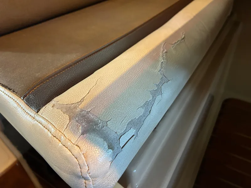Slide: The Image of Cracked upholstery on 2016 Ranger Tugs R-25SC boat seat. - 45