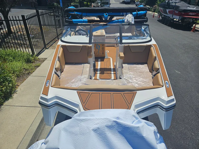 Slide: The Image of 2025 HEYDAY WAKE BOATS WT-2DC, sleek design, parked on street. - 10