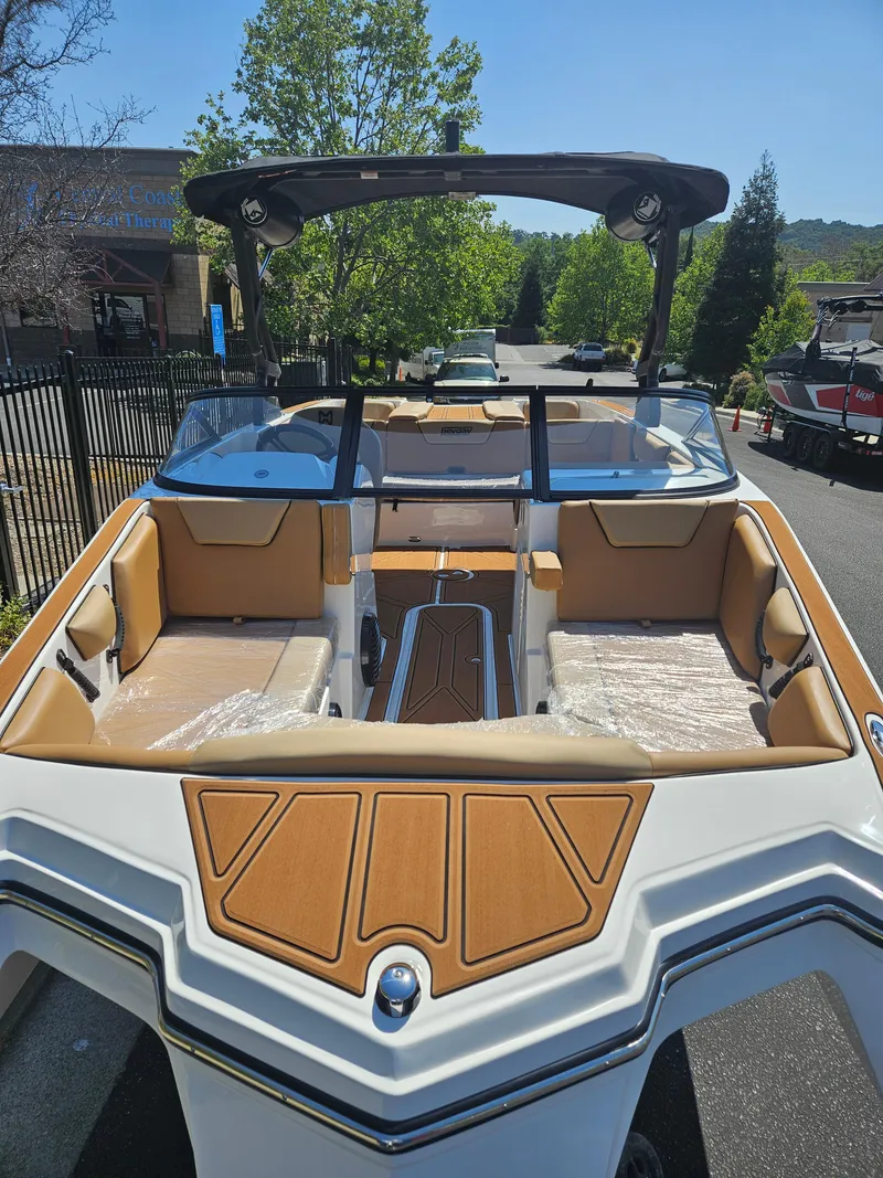 Slide: The Image of 2025 HEYDAY WAKE BOATS WT-2DC with tan interior, parked outdoors. - 3