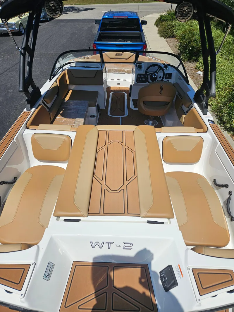 Slide: The Image of 2025 HEYDAY WAKE BOATS WT-2DC interior with tan seating and modern design. - 5