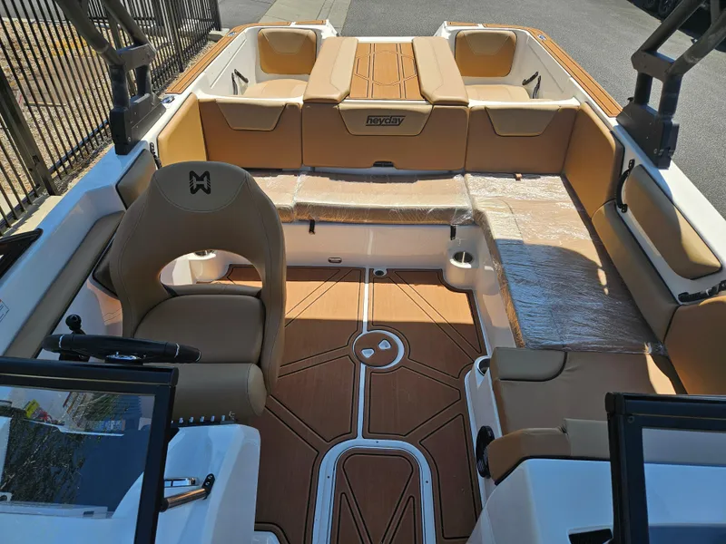 Slide: The Image of 2025 HEYDAY WAKE BOATS WT-2DC interior with tan seating and modern design. - 7