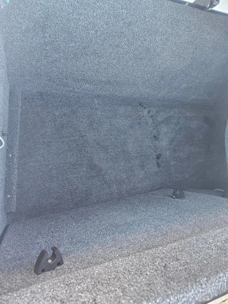 Slide: The Image of Carpeted storage compartment in a 2005 Tigé 22V boat. - 7