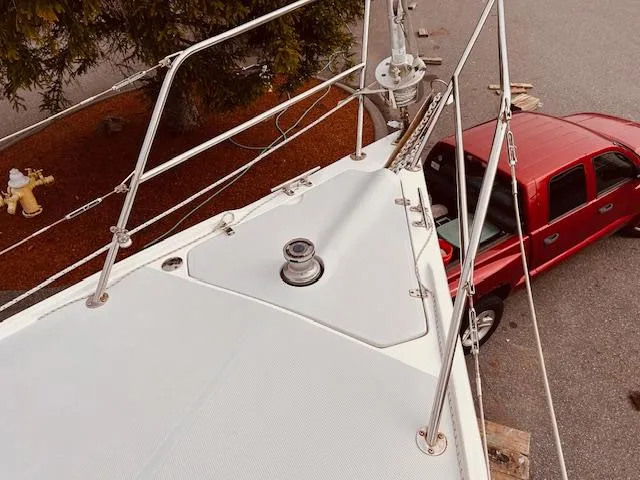 Slide: The Image of Catalina 36 MkII sailboat deck view with red truck nearby, 2003 model. - 11