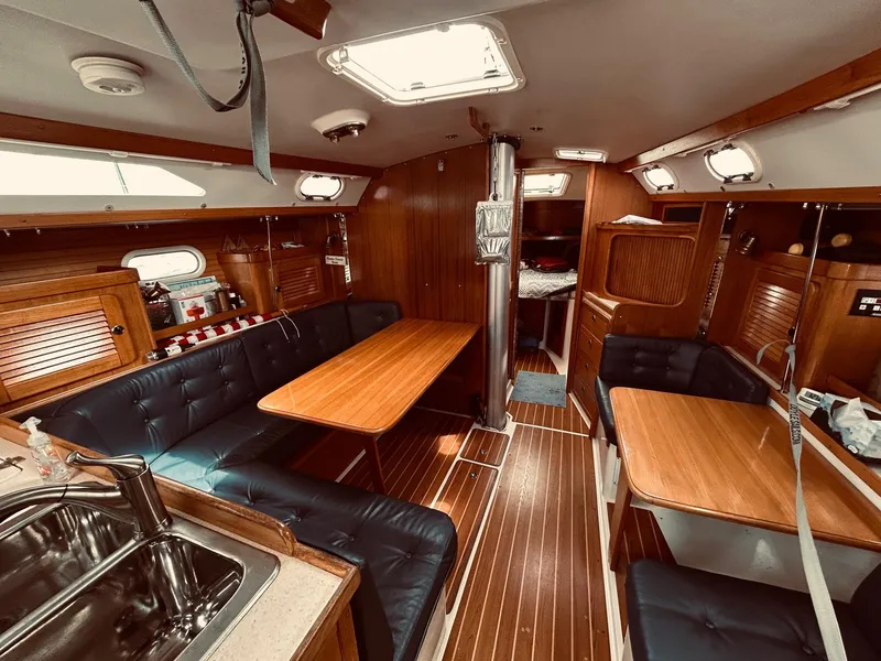 Slide: The Image of Interior of 2003 Catalina 36 MkII sailboat with wood finish and seating area. - 17