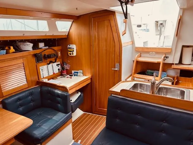 Slide: The Image of Interior of 2003 Catalina 36 MkII sailboat with wood finish and seating area. - 23
