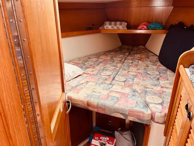 Slide: The Image of Cozy cabin interior of 2003 Catalina 36 MkII sailboat with patterned bedding. - 28