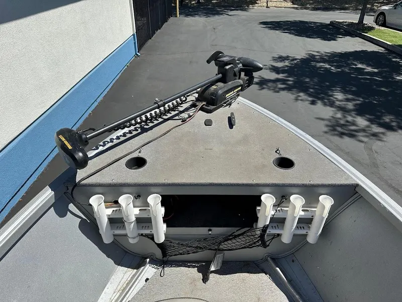 Slide: The Image of 2018 Alumacraft Yukon 165 boat with trolling motor and rod holders. - 12