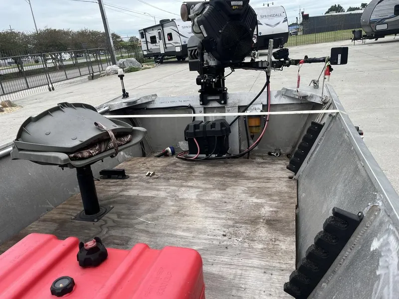 Slide: The Image of Aluminum boat interior with motor, fuel tank, and seating, Custom model 17, year 2006. - 13